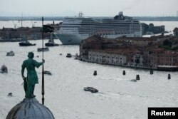 FILE - MSC Magnifica cruise ship passes in the Giudecca Canal in Venice, Italy, June 9, 2019.