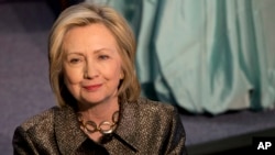 FILE - Democratic presidential candidate Hillary Rodham Clinton attends The Hillary Rodham Clinton Awards for Advancing Women in Peace and Security, in the Riggs Library at Georgetown University in Washington, April 22, 2015.