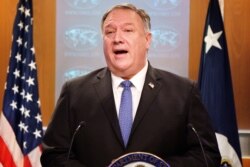 FILE - U.S. Secretary of State Mike Pompeo speaks during a briefing to the media at the State Department in Washington, Nov. 10, 2020.