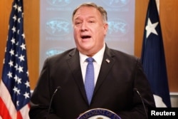 FILE - U.S. Secretary of State Mike Pompeo speaks during a briefing to the media at the State Department in Washington, Nov. 10, 2020.