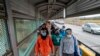 Migrants approach the U.S. border on Gateway International Bridge in Brownsville, Texas on March 2, 2021.