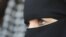 FILE - A 31-year-old French veiled woman, no name released, addresses the media in Nantes, western France, Friday, April 23, 2010.