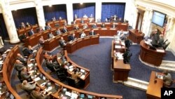 FILE - The Idaho House of Representatives debates legislation in the Idaho Statehouse in Boise, Idaho, Feb. 27, 2020.