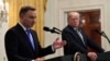 FILE - President Donald Trump, right, listens as Polish President Andrzej Duda speaks during a joint news conference in the East Room of the White House in Washington, Sept. 18, 2018.