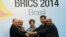 (L-R) Russian President Vladimir Putin, Indian Prime Minister Narendra Modi, Brazilian President Dilma Rousseff, Chinese President Xi Jinping and South African President Jacob Zuma join their hands at a group photo session during the 6th BRICS summit in F