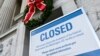 A sign is seen at the National Archives building that is closed because of a partial U.S. government shutdown in Washington, Dec. 22, 2018.