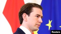 Austria's Chancellor Sebastian Kurz, who is under investigation on suspicion of corruption offenses, arrives to give a statement at the federal chancellery in Vienna, Oct. 9, 2021.