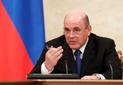 FILE - Russian Prime Minister Mikhail Mishustin speaks during a Cabinet meeting in Moscow, Jan. 30, 2020.
