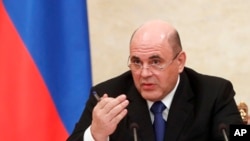 Russian Prime Minister Mikhail Mishustin speaks during a cabinet meeting in Moscow, Jan. 30, 2020. 