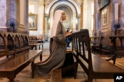 Missionary nun Maria Engracia, from Mexico, prays for the health of Pope Francis at the Metropolitan Cathedral in Buenos Aires, Argentina, Feb. 21, 2025. Catholics around the world have been encouraged to pray for Francis' rapid recovery.