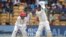 India's Murali Vijay, right, bats during the one-off cricket test match against Afghanistan in Bangalore, India, June 14, 2018.