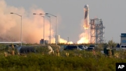 Blue Origin's New Shepard rocket launches carrying passengers Jeff Bezos, founder of Amazon and space tourism company Blue Origin, brother Mark Bezos, Oliver Daemen and Wally Funk, from its spaceport near Van Horn, Texas, July 20, 2021.