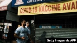 A pharmacy advertises the Covid-19 vaccine in a neighborhood near Brighton Beach on July 22, 2021 in the Brooklyn borough of New York City.