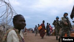 United Nations peacekeepers patrol in the camp for displaced people inside the United Nations Mission in South Sudan (UNMISS) compound in Malakal, Upper Nile State, which is currently held by anti-government forces, March 4, 2014. REUTERS/Andrea Campeanu