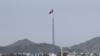 FILE - A North Korean flag flutters in the wind atop a tower in the North's Kijong-dong village near the truce village of Panmunjom in Paju, South Korea on Sept. 28, 2017. South Korea's spy agency said TJuly 16, 2024, that a North Korean diplomat based in Cuba