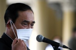 FILE - Thailand Prime Minister Prayuth Chan-ocha attends an agreement signing ceremony for purchase of AstraZeneca's potential COVID-19 vaccine at Government House, amid the spread of the coronavirus disease in Bangkok, Thailand, Nov. 27, 2