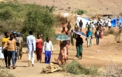 Ethiopian refugees who fled the fighting in Tigray Region are pictured at Umm Rakuba camp in eastern Sudan's Gedaref State, on Nov. 30, 2020.