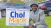 FILE - Chol Majok is seen with a primary election campaign sign in a photo from his Facebook campaign page.