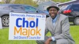 FILE - Chol Majok is seen with a primary election campaign sign in a photo from his Facebook campaign page.