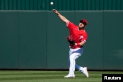 Los Angeles Angels center fielder Mike Trout (27) throws the ball in against the San Francisco Giants in the fourth inning at Tempe Diablo Stadium, Tempe, Arizona, Feb. 27, 2023. Rick Scuteri-USA TODAY Sports