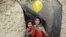 Internally displaced Afghan children play outside their temporary home at a refugee camp in Kabul, Afghanistan.