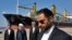 Iranian President Hassan Rouhani, second left, speaks during the inauguration a newly built extension of the port of Chabahar, near the Pakistani border, on the Gulf of Oman, southeastern Iran, Dec. 3, 2017. 