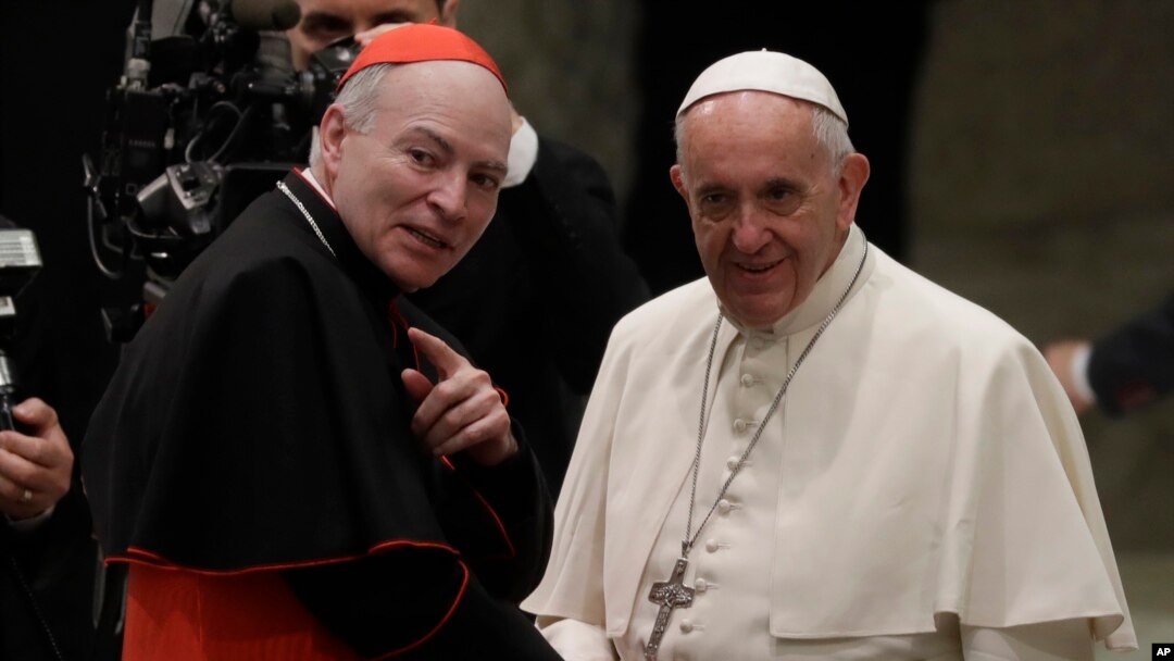 Pope Francis, right, shakes hands with Cardinal Carlos Aguiar Retes, at the Vatican, Nov. 23, 2016. On Thursday, Francis appointed Aguiar archbishop of Mexico City.