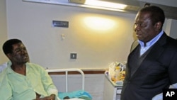 Zimbabwe's Prime Minister Morgan Tsvangirai visits Movement for Democratic Change [MDC] youth leader Yaya Kassim - who was attacked while visiting MDC supporters, allegedly by youths loyal to President Robert Mugabe's ZANU PF party - at a hospital in the 