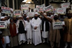 FILE - Indian Muslims protest against the government approving an ordinance to implement a top court ruling striking down a Muslim practice that allows men to instantly divorce in Mumbai, India, Sept. 19, 2018.