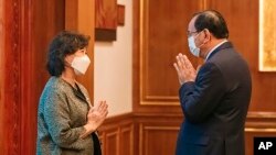 Noeleen Heyzer, the visiting Special Envoy of the Secretary-General of the United Nations on Myanmar, left, greets Cambodian Foreign Minister Prak Sokhonn Thursday, March 31, 2022, in Phnom Penh, Cambodia.