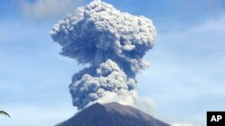 Mount Agung spews ash and smoke in Karangasem, Bali, Indonesia, July 3, 2018