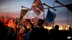 Activist protest outside of the COP25 climate talks congress in Madrid, Spain, Saturday, Dec. 14, 2019.