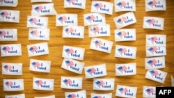 "I Voted" stickers cover a table at a polling station during the North Carolina primary on Super Tuesday in Charlotte, North Carolina, March 3, 2020. 