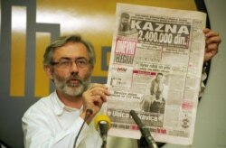 FILE - Slavko Curuvija, who was editor and owner of the daily newspaper Dnevni Telegraf, attends a press conference in Belgrade, in November 1998.