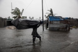 FILE - Residents of the Praia Nova neighborhood seek shelter and protection from Tropical Cyclone Eloise, in Beira, Mozambique, Jan. 23, 2021. (UNICEF/Franco/Handout via Reuters)