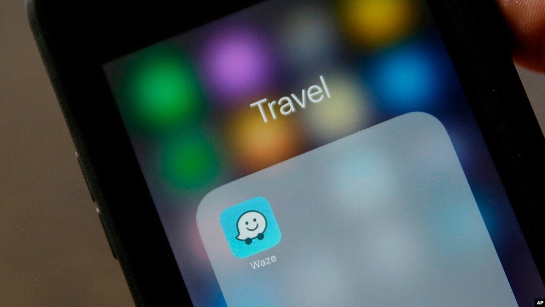 FILE - The Waze application is displayed on a smartphone in San Francisco, March 27, 2017. 