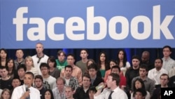 FILE - President Barack Obama, accompanied by Facebook CEO Mark Zuckerberg, speaks during a town hall at Facebook headquarters, Palo Alto, California, April 20, 2011.