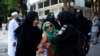 Security personnel detain supporters of imprisoned former Prime Minister Imran Khan's party Pakistan Tehreek-e-Insaf during a protest in Islamabad, Pakistan, Oct. 4, 2024.