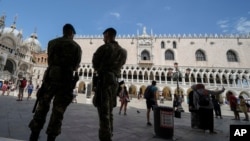Italian soldiers patrol St. Mark's Square during a G-20 meeting of Economy and Finance ministers and Central bank governors in Venice, Italy, July 8, 2021.