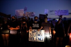 FILE - Protesters block traffic on the highway during protests June 13, 2020, near the Atlanta Wendy's where Rayshard Brooks was shot and killed by police following a struggle in the restaurant's drive-thru line in Atlanta.