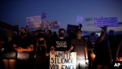 Protesters block traffic on the highway during protests June 13, 2020, near the Atlanta Wendy's where Rayshard Brooks was shot and killed by police following a struggle in the restaurant's drive-thru line in Atlanta.