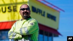 Photo taken on April 28, 2018, in Nashville, Tenn., shows Chuck Cordero standing at the Waffle House where four people were shot and killed. 