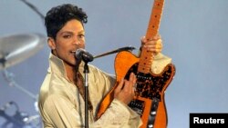 U.S. musician Prince performs for the first time in Britain since 2007 at the Hop Farm Festival near Paddock Wood, southern England, July 3, 2011. 