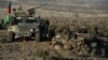 Afghan security forces take positions following an operation against Islamic State militants in Pachir Agam district of Nangarhar province, Dec. 3, 2016. 