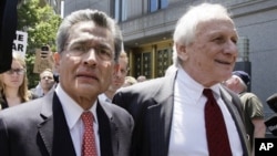 Former Goldman Sachs director Rajat Gupta, left, and attorney Gary P. Naftalis, leave federal court, New York, June 15, 2012.