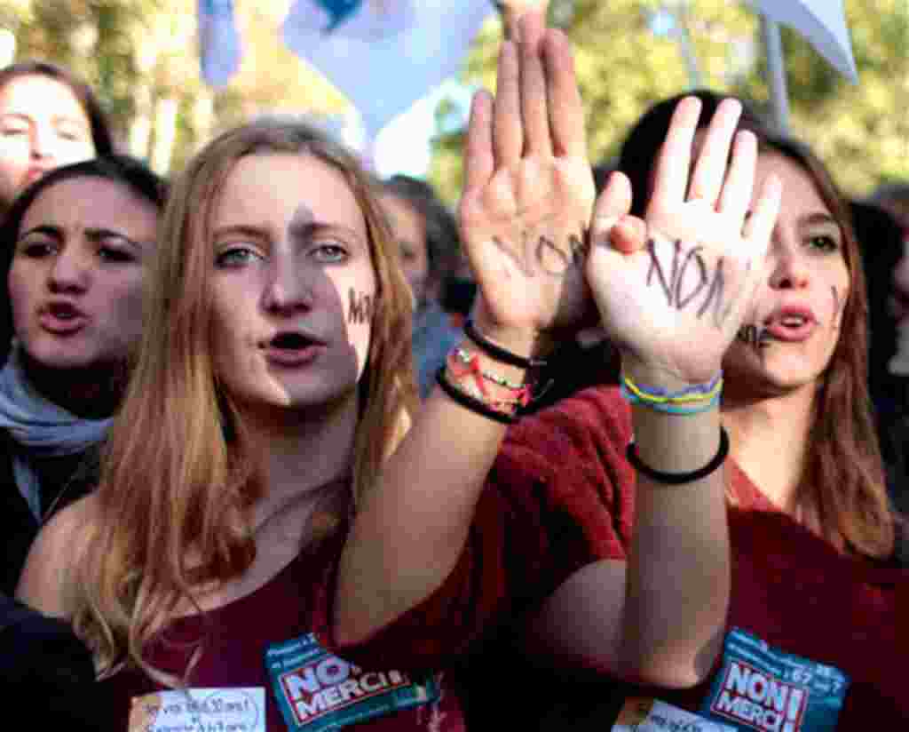French students hold up their hands painted with "No" during a protest in Paris, Thursday Oct. 21, 2010. Protesters blockaded Marseille's airport, Lady Gaga canceled concerts in Paris and rioting youths attacked police in Lyon on ahead of a tense Senate v