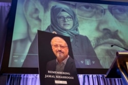 FILE - In this Nov. 2, 2018, photo, a video image of Hatice Cengiz, fiancee of slain Saudi journalist Jamal Khashoggi, picured below, is displayed during a memorial event in Washington, Oct. 2, 2018.