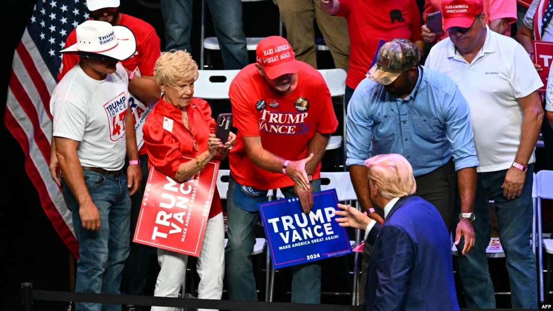 Former President and Republican presidential candidate Donald Trump greets supporters after speaking at a campaign rally at Johnny Mercer Theatre Civic Center in Savannah, Georgia, on Sept. 24, 2024. 