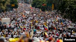 Opposition supporters march protest against Nicolas Maduro's government in Caracas, Venezuela, Feb. 22, 2014. 