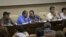 Mauricio Jaramillo, a spokesman and top leader of the Revolutionary Armed Forces of Colombia, or FARC, second from left, talks with FARC member Andres Paris during a press conference in Havana, Cuba, September 6, 2012.